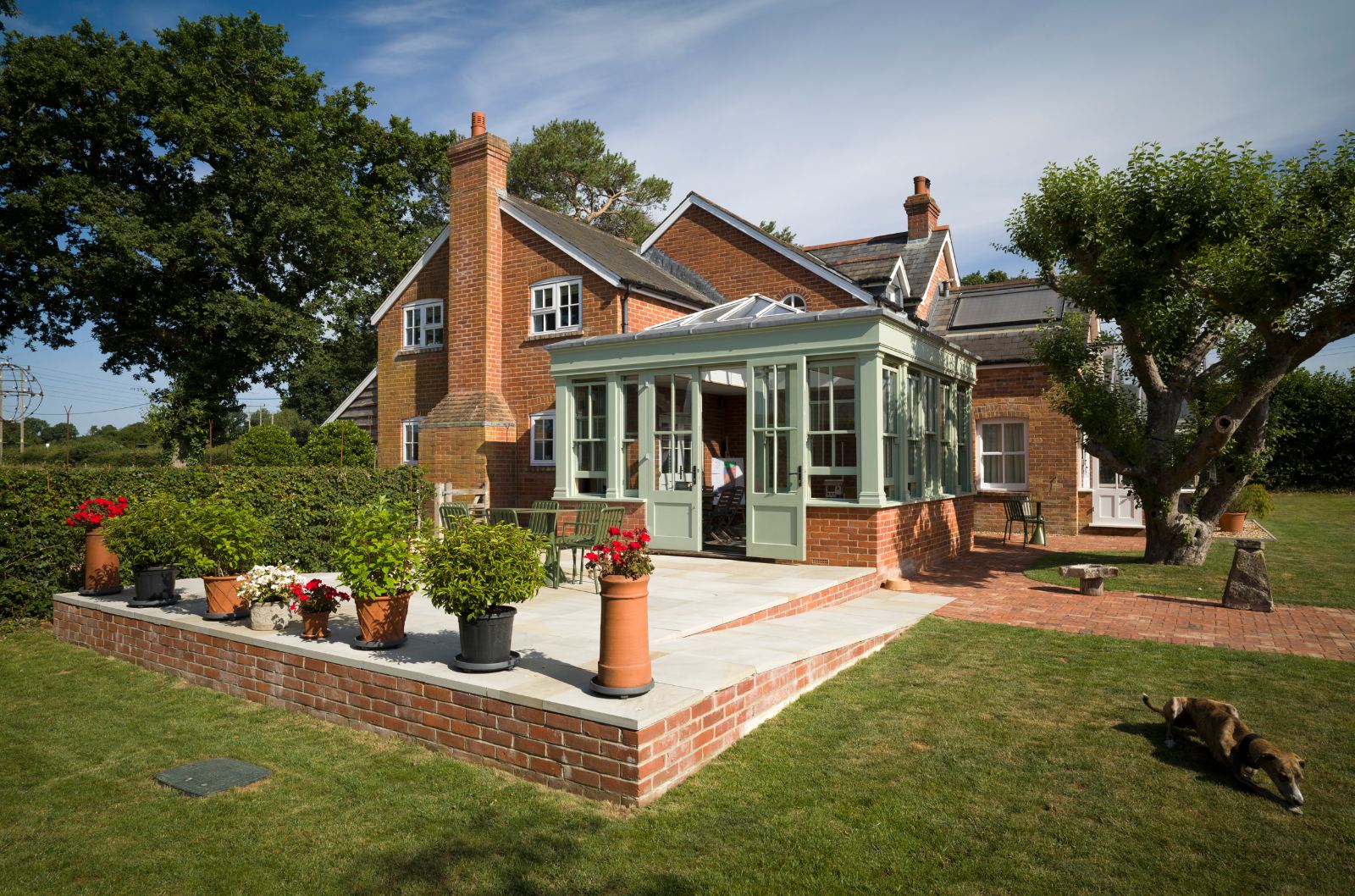 House and orangery seen across the lawn